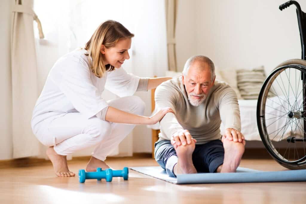 Mobility Experts in Community Care | elderly man stretching touching toes